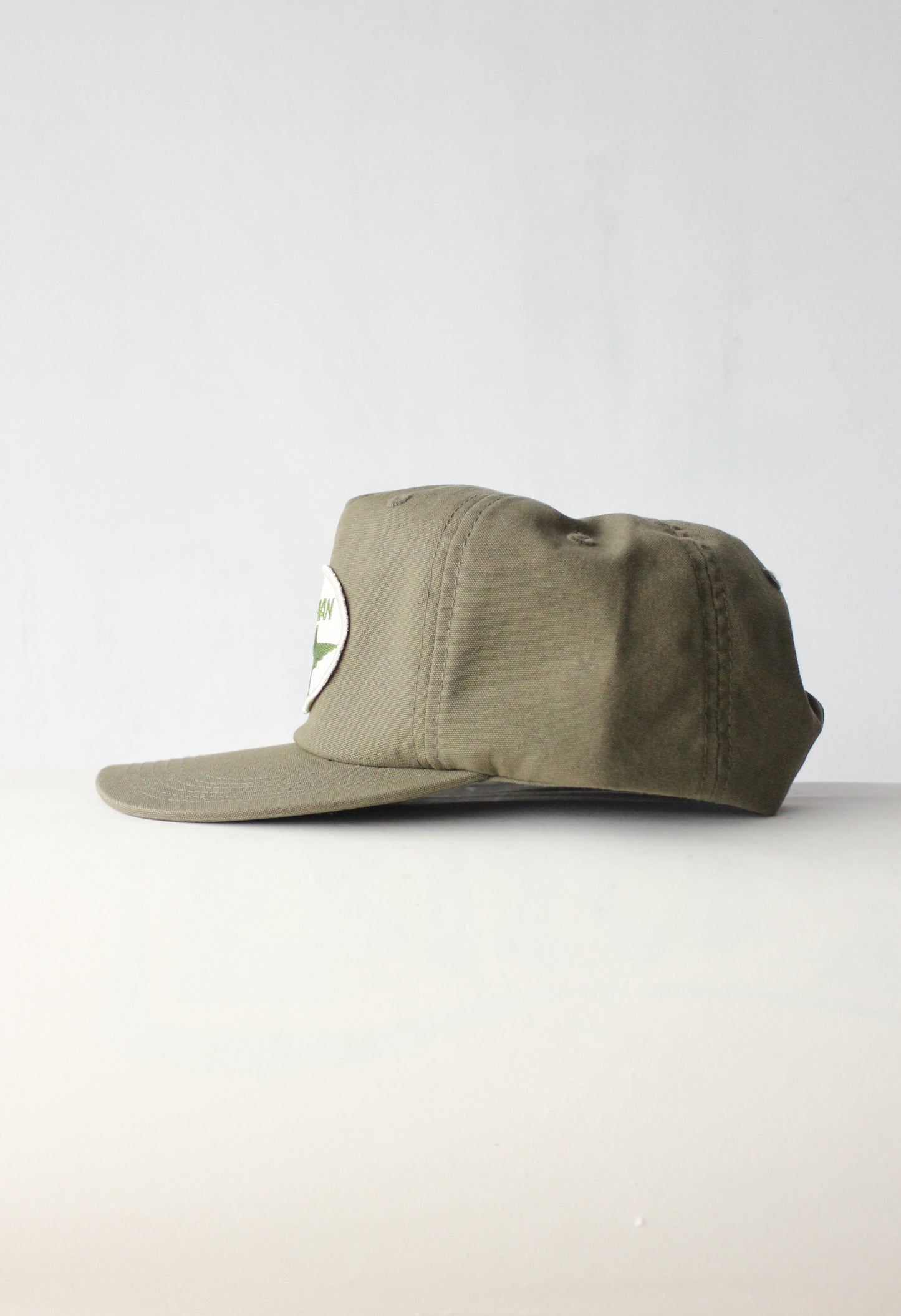 The " Mech-man wing " herb green snapback