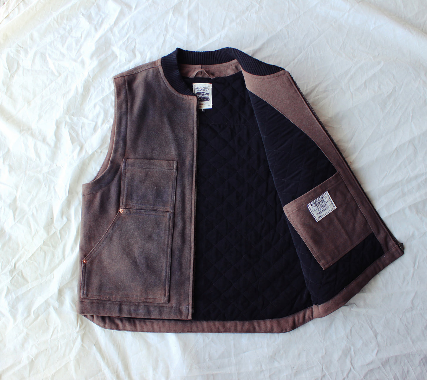 The “ 077  logger vest “ waxed canvas / quilted vers.